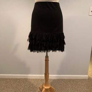 Short black skirt with ruffles
